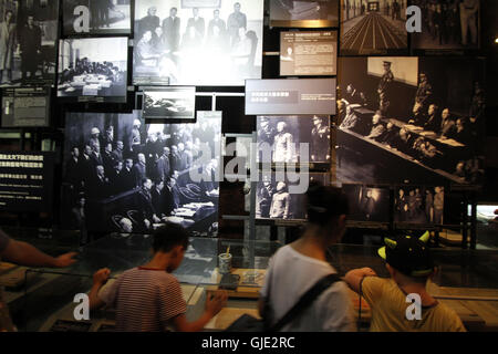 Nanjing, Nanjing, China. 16th Aug, 2016. Nanjing, CHINA - August 6 2016: (EDITORIAL USE ONLY. CHINA OUT) Visitors look at the files and ironclads of Japanese invaders' cruel massacre at Nanjing Massacre VictimsÂ¡Â¯ Memorial Hall. Tomomi Inada, who was appointed as Japanese defense minister, denied the existence of killing competition during the Nanjing Massacre that left an estimated 300,000 people dead in interviews with local media on August 4, 2016. China recently slammed the new Japanese ministerÂ¡Â¯s fault of denying the history and said that Japan should face up to the fact. (Credit I Stock Photo