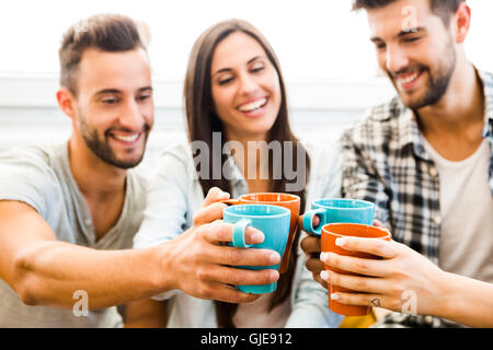 Group of friends making a toast with coffee Stock Photo