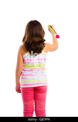 Beautiful young girl holding a big pencil and writing something on a glass wall Stock Photo