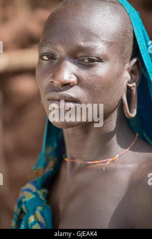 A Suri (Surma) naked young man body painted with mud, Ethiopia Stock