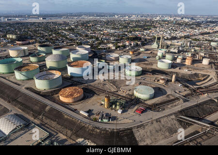 El Segundo, California, USA - August 6, 2016:  Afternoon aerial view of oil refinery tanks overlooking residential neighborhoods Stock Photo