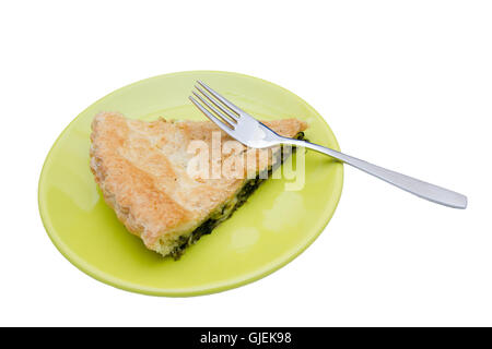 Slice of pie with spinach and cheese on a white background Stock Photo