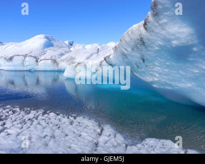 melting ice in Greenland - ice cave with blue water on inland ice sheet Stock Photo