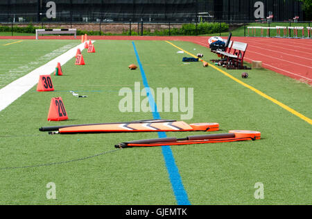 Orange field markers on football field Stock Photo