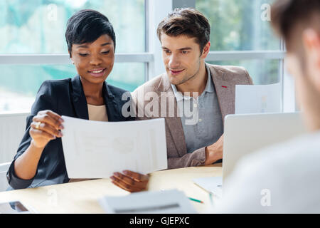 Creative group of young people brainstorming on meeting in office Stock Photo