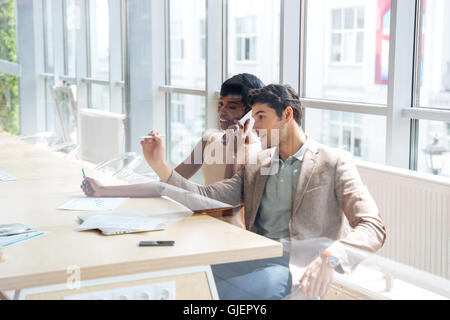 Business woman and man working together in conference room Stock Photo