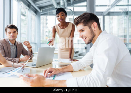 Group of creative young people making new project together in conference room Stock Photo