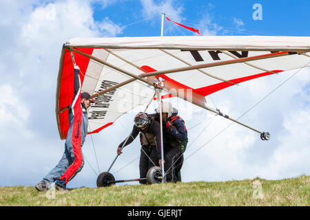 Hang glider training. A hang gliding trainer and trainee preparing to take off in tandem at Bradwell Edge, Derbyshire, Peak District, England, UK Stock Photo