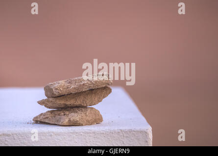 Three rough stones placed on top of each other Stock Photo