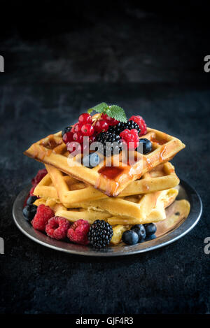 Traditional Belgium waffles with berry fruits and ice cream on wooden ...