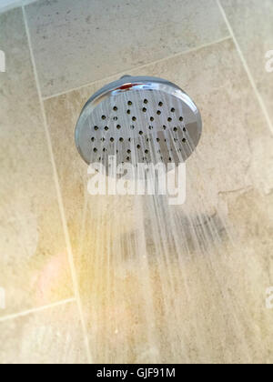 Water Running from Metal Shower Head Fixture Stock Photo