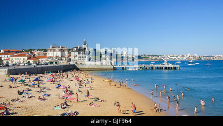 CASCAIS, PORTUGAL - JULY 15, 2016: Famous beach in the Bay of Cascais, a Portuguese coastal town 30 km west of Lisbon. Stock Photo