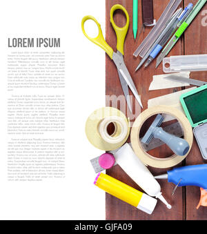 many stationery on wooden plank Stock Photo