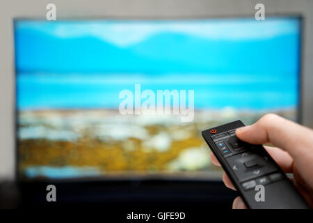 Television remote control changes channels Stock Photo