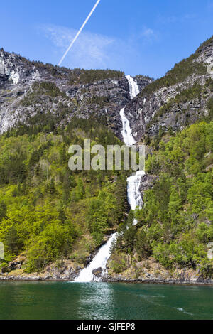 A waterfall in a stunning setting along the Sognefjord between the villages of Flam and Gudvangen  in Norway Stock Photo