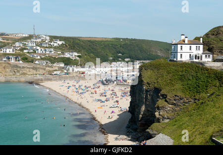 Portreath beach shore near high tide in Cornwall England. Looking down from a hill on a sunny summers day. Stock Photo
