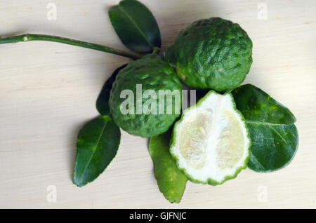 Bergamot (Also known as Kaffir lime, Citrus lime, Citrus bergamia, Citrus, Bergamot, Magnoliophyta Rutaceae) fruits with leaf Stock Photo