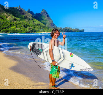 Surfer at Tunnels Beach on Kauai Stock Photo