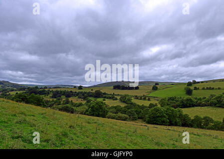 The rolling hills of the Pennines, near Chapel-en-le-Frith in Derbyshire, under a grey coudy sky Stock Photo