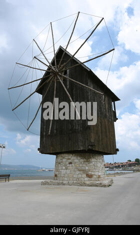 NESSEBAR, BULGARIA - JUNE 12, 2011: The old wood windmill on the coast in the old Nessebar town, Sunny Beach, Bulgaria. Stock Photo