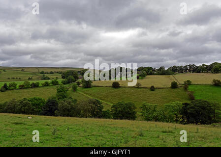 The rolling hills of the Pennines, near Chapel-en-le-Frith in Derbyshire, under a grey coudy sky Stock Photo