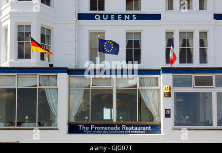 EU flag and German flag in front of the Queens Hotel in Penzance, Cornwall, UK. Stock Photo