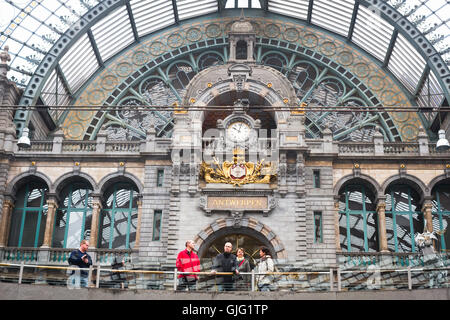 Travellers wait inside the Centraal Station, Antwerp Stock Photo