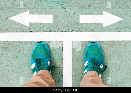 Top view of man's legs choosing his way Stock Photo