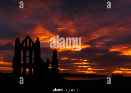 Whitby Abbey against a dramatic fiery sunset. In Whitby, North Yorkshire, England. On 12th August 2016 Stock Photo