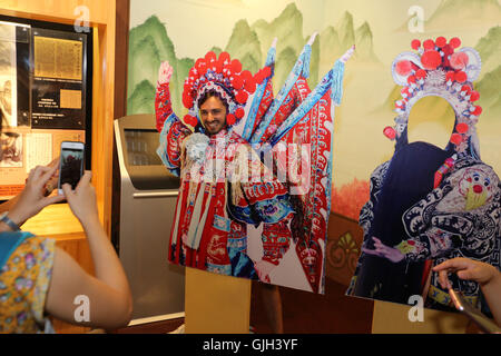 Nantong, Nantong, China. 17th Aug, 2016. Nantong, CHINA-August 2 2016-(EDITORIAL USE ONLY. CHINA OUT) A college student from Israel enjoys the charm of Peking Opera. More than 30 college students from China and abroad visit Nantong Blue Calico Museum, China Abacuses Museum, Association of Opera Artists, studio of intangible cultural heritage and other places, appreciating the beauty of Chinese intangible cultural heritage including Peking Opera and Chinese abacus. The visiting team, consisting of students from Tel Aviv University, University of Haifa, University of Hebrew, Renmin Univers Stock Photo