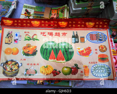 Anyang, Anyang, China. 17th Aug, 2016. Anyang, CHINA-?August 16?2016:?(EDITORIAL?USE?ONLY.?CHINA?OUT) Various weird offerings including fake iPhones, villas, false paper money and cigarettes are on sale in Hua County, central ChinaÂ¡Â¯s Henan Province, before the traditional Zhongyuan Festival comes. Chinese traditional Zhongyuan Festival, also known as Ghost Festival, is celebrated on 15th day of the seventh lunar month. People usually burn incense and paper money as an offering to the spirits of deceased ancestors during the festival. © SIPA Asia/ZUMA Wire/Alamy Live News Stock Photo