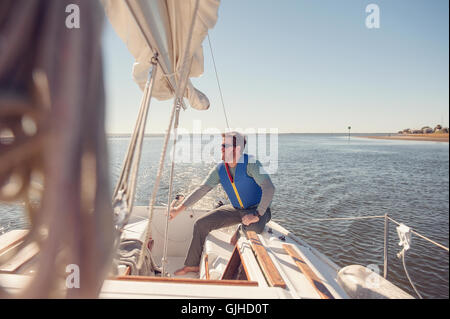 Man sailing sailboat, Florida, United States Stock Photo