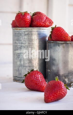 Strawberries in metal containers Stock Photo