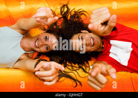 young couple playing on the bed Stock Photo