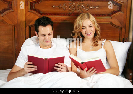 reading in bed Stock Photo