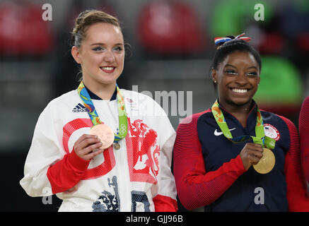 Great Britain's Amy Tinkler celebrates a bronze meda with Gold medalist Simone Biles following the Women's Floor Exercise final at the Rio Olympic Arena on the eleventh day of the Rio Olympics Games, Brazil. Stock Photo