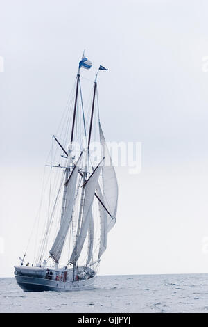 white gaffelschoner sails on the sea Stock Photo