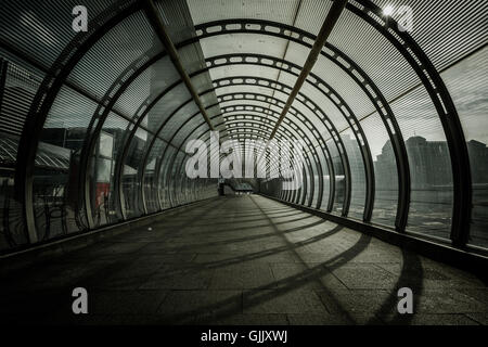 Poplar tunnel / walkway at DLR Docklands Light Railway station, London, United Kingdom Stock Photo