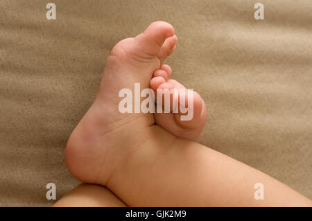 baby feet beige Stock Photo