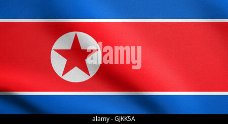 Flag of North Korea, Democratic Peoples Republic of Korea waving in the wind with detailed fabric texture. North Korean, DPRK, n Stock Photo