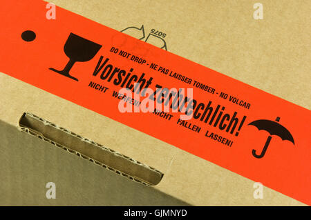package with sticker caution fragile Stock Photo