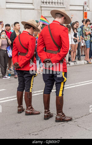 Montreal, CA - 16/08/14: Two Royal Canadian Mounted Police officers observe a minute of silence in memory of Orlando victims Stock Photo