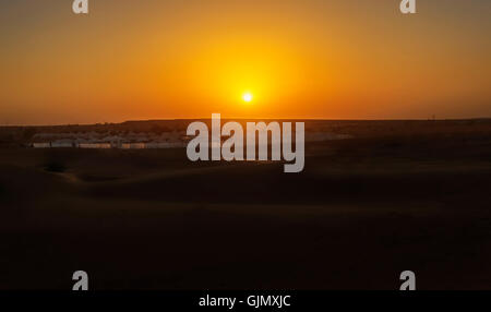 Golden Sunset at SAM dunes of Indian Thar Desert with camps and tents copy space Stock Photo