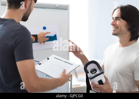 Positive colleagues working on the project Stock Photo