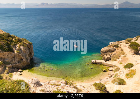 Perachora Ireon lake in Greece with beautiful green water and a fast boat in it. Stock Photo