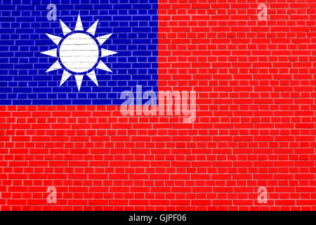Flag of the Republic of China, ROC, Taiwan, on brick wall texture background. The national flag of Taiwan. Stock Photo