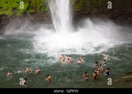 People swimming in the La Fortuna waterfall, Arenal, Costa Rica Central America