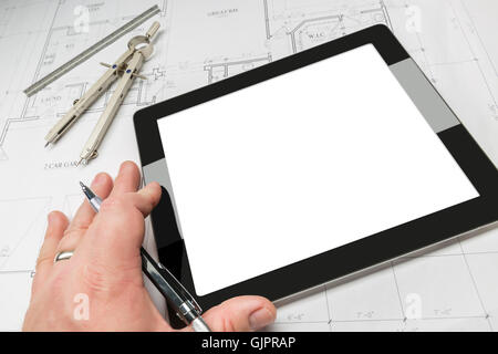 Architect Working on Blank Computer Tablet, Over House Plans, Pencil, Compass. Contains Screen Clipping Path. Stock Photo