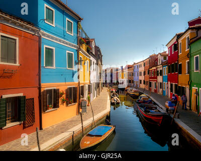 The traditional colourful painted canal side houses on the island of Burano. Venice, Italy. Stock Photo