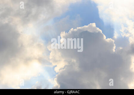 Stormy clouds with a small break and sky in the background. Stock Photo